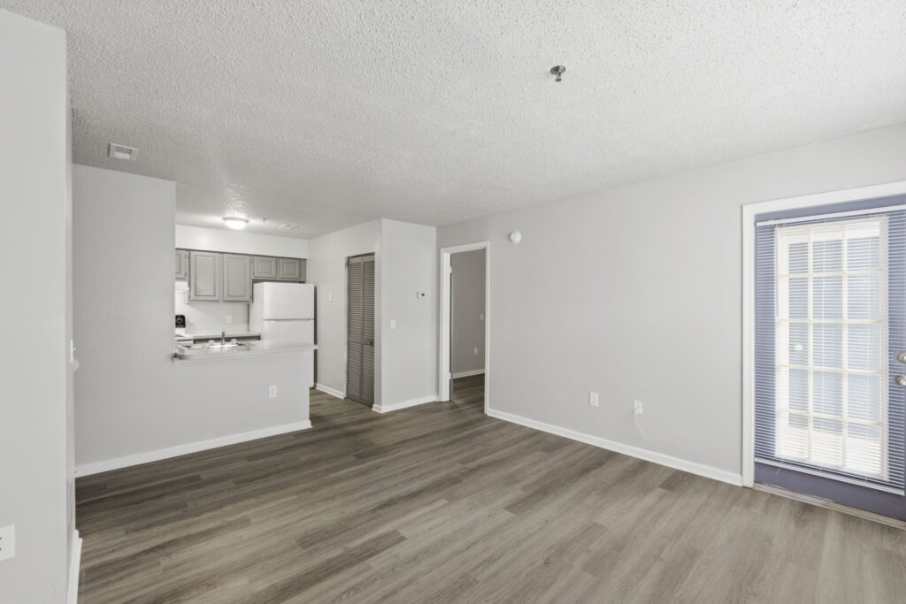 Quartermill Apartments living room with door to patio